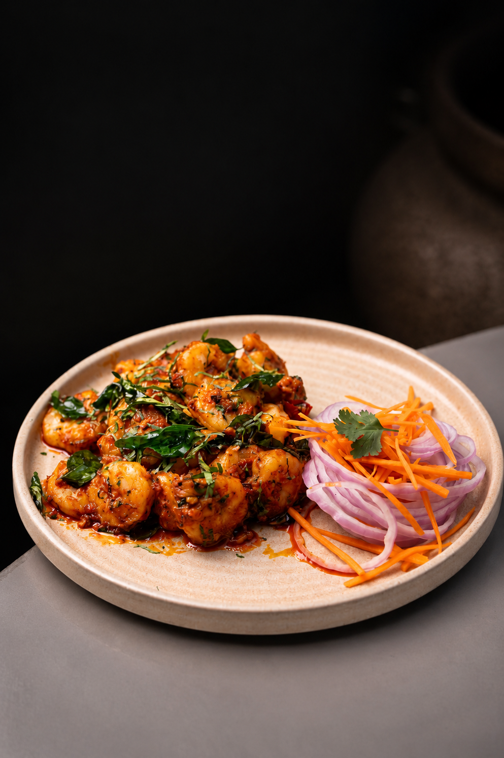 Shrimp fry plated with pickled onions